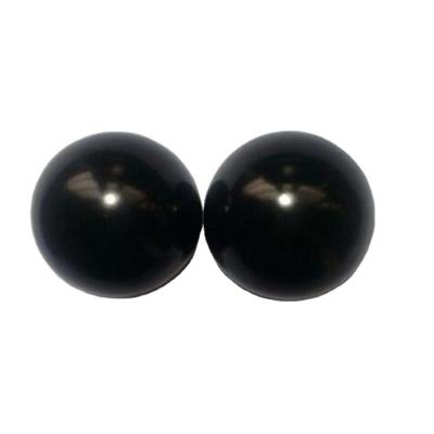 Chine 50 mm sculpté Natural Black Bian Stone Hand Ball Massage Sphère de cristal de guérison lisse pour le massage et la guérison du corps à vendre