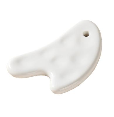 China Body Muscles Heart Shape Ceramic Gua Sha Scraping Board for Comfortable Body and Facial Massage Tool for sale