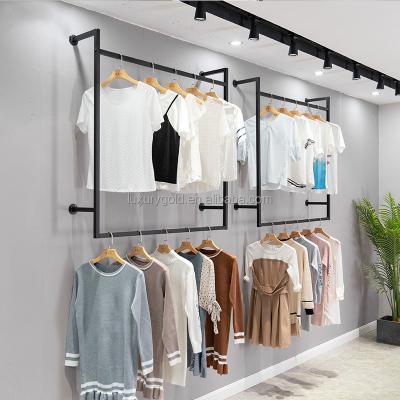 China Clothes Shop Gold Wall Clothing Rack Boutique Black Bipolar Garment Display Rack Dress Cloth Racks Stainless Steel For Store for sale