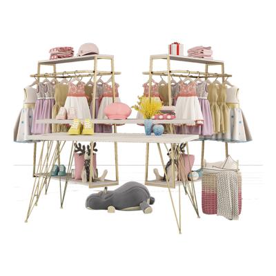 China Clothes Shop Gold Kid Clothing Rack Clothing Retail Nesting Table Clothes Kids Garment Display Rack Baby Store Shelf Design for sale