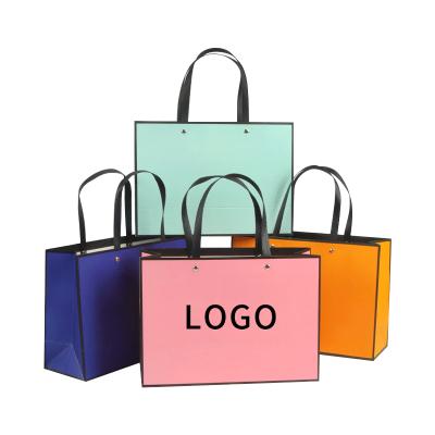 China Luxury Recyclable Ribbon Handle Boutique Shopping Bag Packaging Customized Euro Printed Tote Paper Gift Bags With Logo for sale