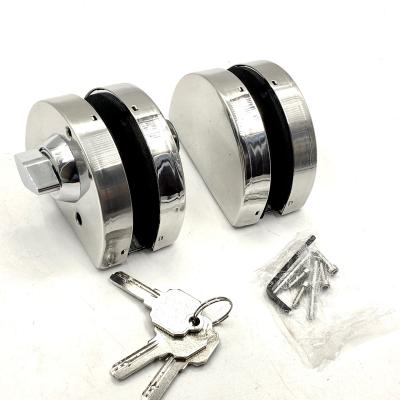 China Modern Customized Bilateral Round Shape Glass Swing Glass Door Lock Accessories Oval Sliding Glass Door Lock With Key for sale