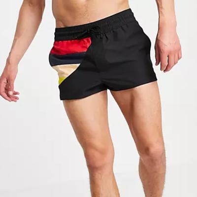 China 2021 Anti-wrinkle hot sale summer shorts color block design shorts swimwear elastic men's waist shorts for sale