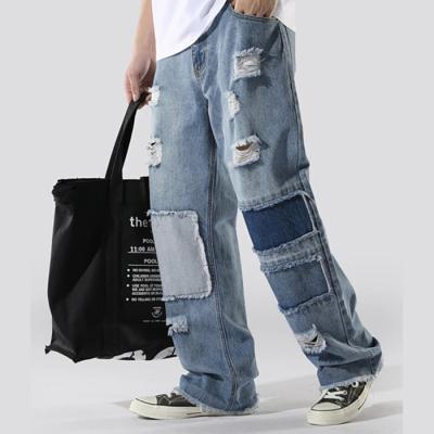 China Breathable hot selling color block patched denim fabric jeans ripped wid leg straight men jeans for sale