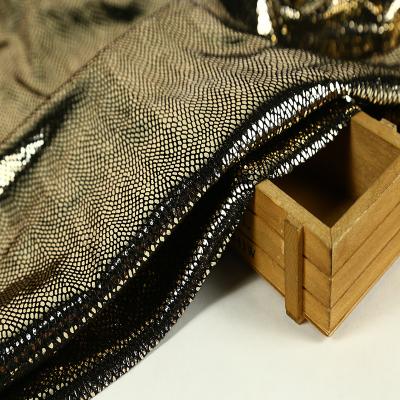 China Sparkly Stretch Polyester Gold Foil Mermaid Fish Scales Stage Fabric Hot Sale 2021 Black Ground Dancer Velvet Stretch Fabric New for sale