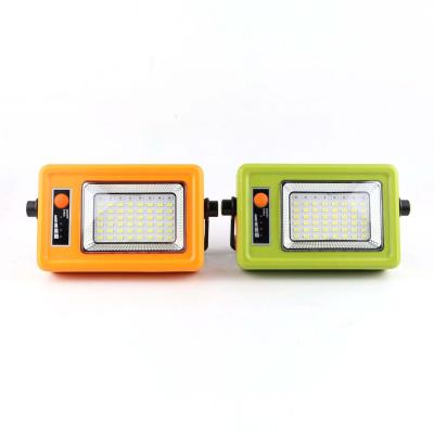 China Outdoor 6000mah 124 LED Rechargeable Solar Light Outdoor Portable Tent Lights Floodlight Built-in Stand Battery Magnetic Work Lamp for sale