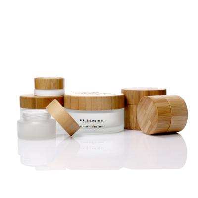 China Eco Friendly 5ml 15ml 30ml 50ml 100ml Cosmetic Cosmetic Packaging Frosted Bamboo Jar Bamboo Cosmetic Jars Glass Jars With Wooden Lid for sale