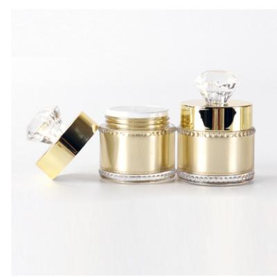 China 5g 15g 30g 50g Gold Cosmetic Container Jar Luxury Shiny Cosmetic Cream Container Acrylic Jar With Clear Crystal Cap for sale