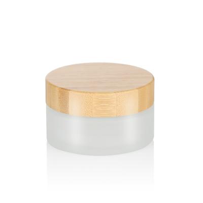 China Bamboo Cosmetic Packaging 5ml 10ml 15ml 20ml 30ml 50ml 100ml Bamboo Cream Jar Skin Care Engraving Frosted Glass Jars With Wooden Lid for sale