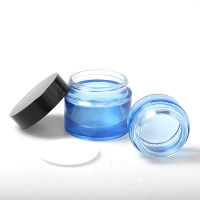 China Skin Care Cream Cosmetic Packaging 50g Cobalt Blue Glass Cosmetic Jars 50ml Glass Jars With Black Screw Cap for sale