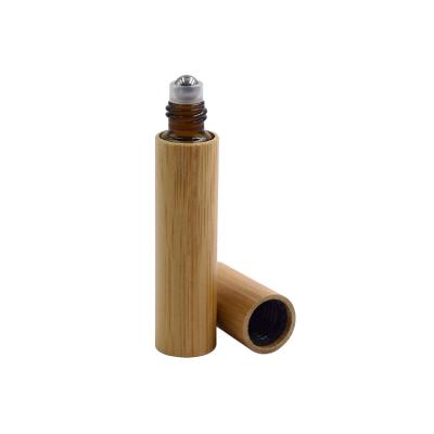 China 5ml 8ml 10ml 15ml cosmetics wooden bamboo container air freshener glass roller bottle essential oil container with stainless roller for sale