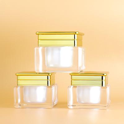 China Cosmetics Skin Care Products 50g 30ml Double Wall Gold Square Luxury Cosmetic Jars Packaging Acrylic Eye Cream Jar for sale