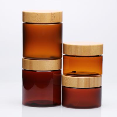 China Food Grade 150ml Cosmetic Wide Mouth Cosmetic Container Frosted Clear Amber PET Plastic Cream Jar With Bamboo Lid for sale