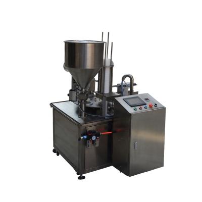 China Plastic automatic rotary type food cup or box yogurt cup filling sealing machine for sale for sale