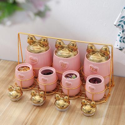 China Cute Freshness Preservation Plant Outlet Butterfly Lid Storage Jar Home Kitchen Supplies Rack Seal Ceramic Pot Set With Rack for sale