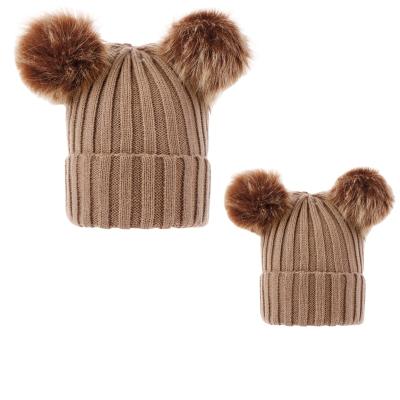 China COMMON Wholesale Winter Fur Pom Pom Warm Simple Mum and Baby Knitted Beanie Hat Set for sale