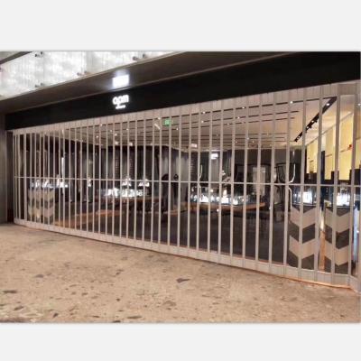 China Transparent the latest safety standard polycarbonate PC tall shopping malls crystal folding door grill design for sale