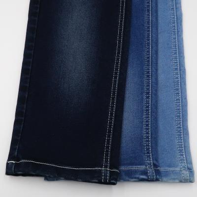 China Breathable Denim Fabric Cotton Polyester Spandex 9oz Stretch Denim Imitation Knitted Fabric Rolls Jean for sale