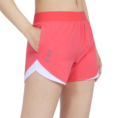 China 2020 Fashionable Women's Shorts QUICK DRY Yoga Workout Sporty Biker Shorts Compression Exercise Shorts With Side Pockets for sale