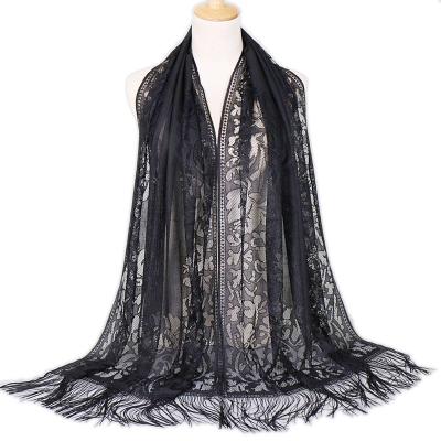 China Lady Nylon Ventilate Hijab Satin Muslim Turban Tassel Scarf Hollow Out Lace Up Shawl Polyester Scarf for sale