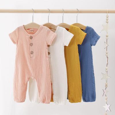 China Summer Breathable Eco-Friendly Shorts Sleeves 100% Cotton Canvas Newborn Baby Romper Ruffles Single Color Baby Overalls for sale