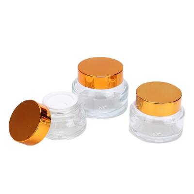 China 15g 30g 50g Cosmetic Wholesale Empty Clear Glass Cream Jar Slanted To Shoulder Glass Cosmetic Cream Jar for sale