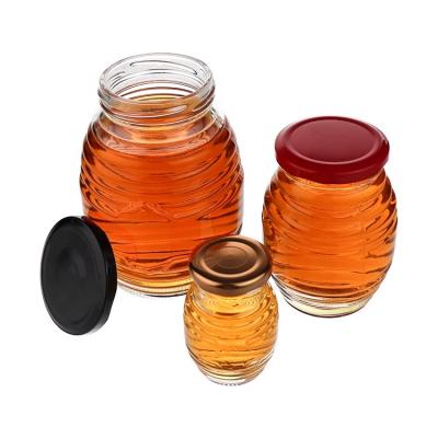 China 2021 Viable New Design Bee Shaped Glass Jam Honey Pot Jar Storage Container Glass Food Packaging Jar With Metal Cap for sale