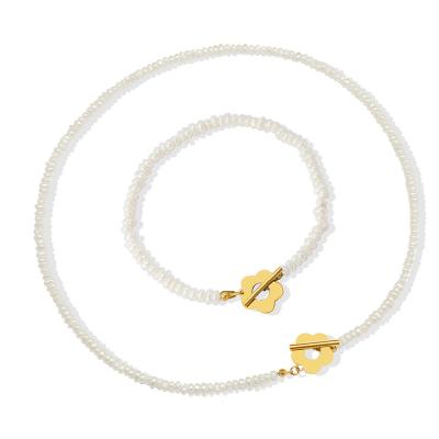 China FASHIONABLE design flower baroque freshwater pearl stainless steel necklace and bracelet set for women for sale