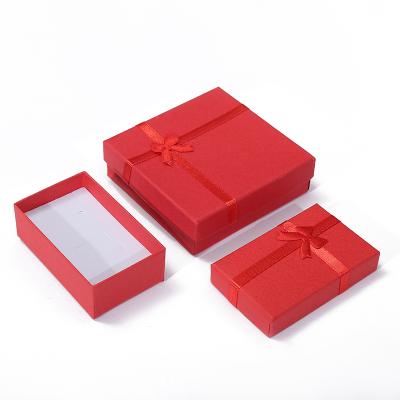 China Jewelry Packaging Custom Logo Box Foam Filler Jewelry Box Packaging Bow Print Keepsake Jewelry Box Jewelry Custom Logo for sale