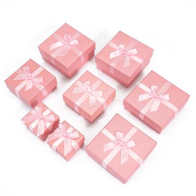 China Jewelry Packing Custom Logo Cross Ribbon Bow Print Square Jewelry Boxes Accessories Jewelry Packaging Box Paper Package Box for sale