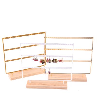 China Jewelry Display 3-Tier Jewelry Display Stand Metal With Wooden Base Earring Holder 69 Holes Piercing Jewelry Display for sale