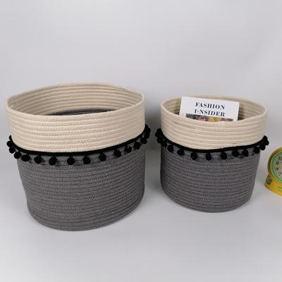 China Minimalist wholesale modern design storage basket stitched cotton rope basket with black decorative lace at center section for sale