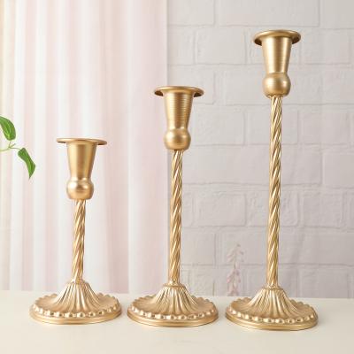 China Home Decoration Vintage Candlestick Wrought Iron Golden Candlestick Crafts Table Decoration for sale