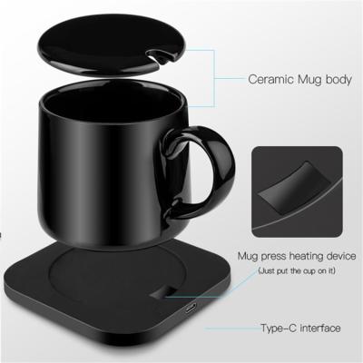 China Smart Electric Cell Phone Coffee Cup Mug With Heater Pad Temperature Control Smart Electric Heater Durable Porcelain Qi Universal for sale