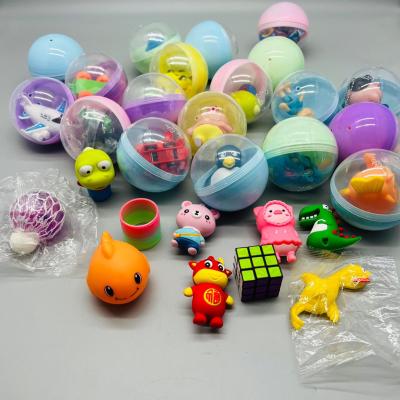 China Mixed Eggs 75mm Interesting Macarone Surprise Egg Twisting Machine Gift Toy Ball Twist Balls Surprise Smart Plastic Egg Capsule for sale