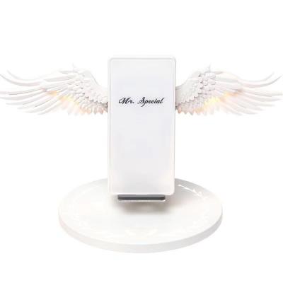 China Smart Phone Wireless Charger Mobile Phone Dock Base 10W Support LED Angel Wings Wireless Charger Fast Wireless Universal for sale