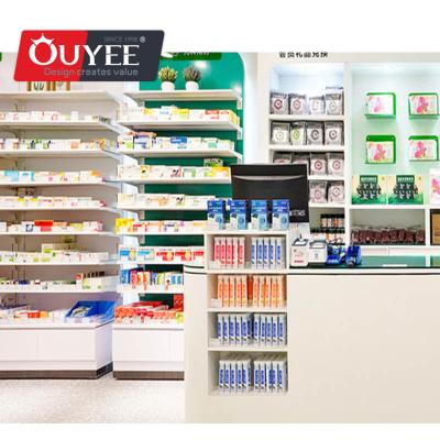 China Latest Customized Modern Interior Designed Pharmacy Store Customized Modern Wood Showcase Cabinet With Pharmacy Shelves en venta