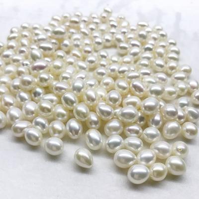 China Half Ring AAA 8-10mm Rice Drop Pearl White Color Pearl Natural Freshwater Half Drilled Rice Pearl Beads for sale