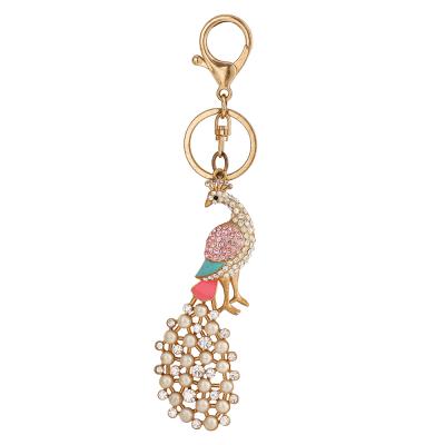 China Crystal+Metal New Arrivals Alloy Rhinestone Metal Key Chains Cute Peacock Pearl Crystal Pendant Luxury Jewelry Key Chain For Gifts for sale