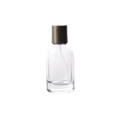 China New Arrival 50ml 100ml Perfume Cosmetic Clear Round Bottle Glass With Matte Black Pump Spray Lid for sale