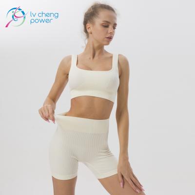 China Breathable Seamless Female Yoga Wear Suit Threaded Yoga Knit Buttocks Fitness Shorts Sportswear Two Piece Set for sale