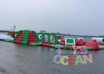 China Green Red And White 0.9mm PVC Inflatable Floating Water Parrk For Adults for sale