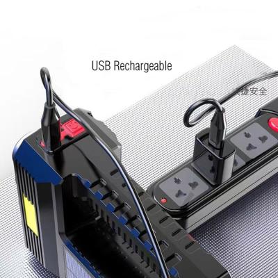 China Industrial Cheap Plastic Portable 8 USB Rechargeable Handheld Torch Led Solar Spotlight for sale