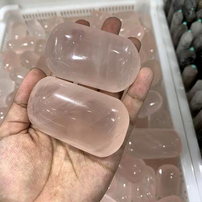 China China Wholeale High Quartz Rose Quartz Pillow Carving Palms Rose Quartz Palm Stone For Decor for sale