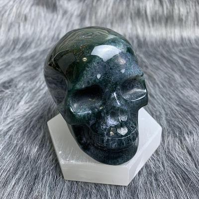 China China Wholesale Natural Crystal Skulls Green Moss Agate Skulls Gemstone For Decor for sale