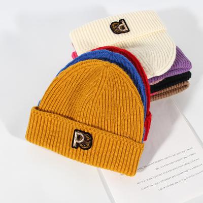 China 2021 JOINT Winter Warm Winter PAGE Letter Sale Beanie Cap Unisex Hats for sale