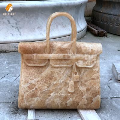 China Decoration EUROPEAN Custom Hand Carved Natural Stone Carving Sculpture Kelly Statue Beige Marble Bag of Magic for sale