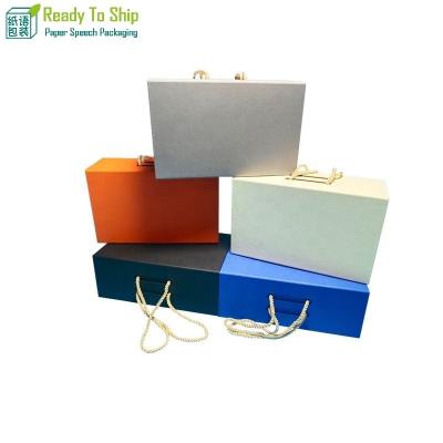 China Handmade Festive Cardboard Folding Paper Boxes Magnetic Folding Gift Box Lid With Ribbon Closures Book Shaped Luxury Flat Packing Boxes for sale