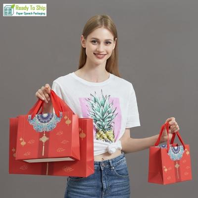 China Handmade Stain Spring Festival Happy Wedding Paper Gift Bag Mid-Autumn Festival New Year Red Paper Bag Chinese Red Paper Bag for sale