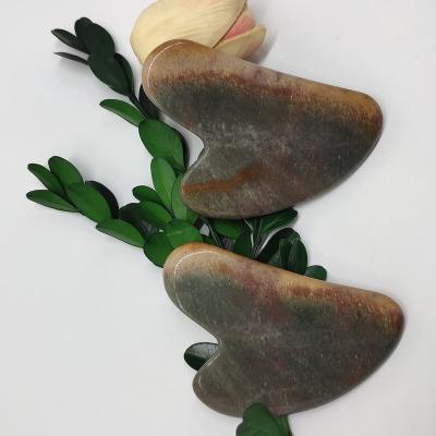 China Dong Ling Jade Red V Shaped Guasha Tool Guasha Face Massage Scratching Stone For Face for sale